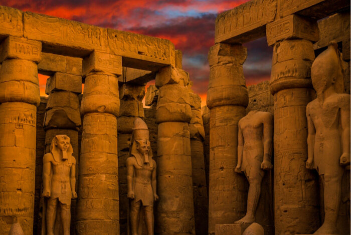 a wonderful view of a group of statues inside one of the ancient egyptian temples egypt736955577